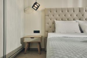 Cama ou camas em um quarto em Mouzaki's Stone Villas