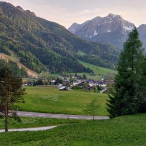 a town in a valley with mountains in the background at APARTMA 27 in Kranjska Gora