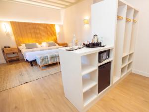 Postel nebo postele na pokoji v ubytování Isla Canela Golf Hotel Boutique