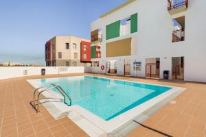 a swimming pool in the middle of a building at Roseville in Puerto del Rosario
