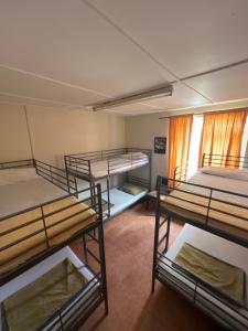 a group of bunk beds in a room at Emile Youth Hostel in Gibraltar