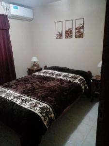 Un pat sau paturi într-o cameră la Posadas Centro