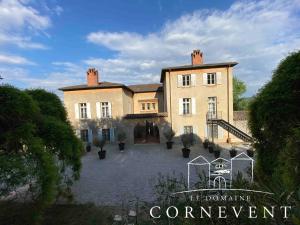 a large house with a courtyard in front of it at Appartement scandinave élégant, Domaine Cornevent Lyon, parc & piscine in Vernaison