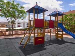 a playground with a slide at BQ Can Picafort Hotel in Can Picafort