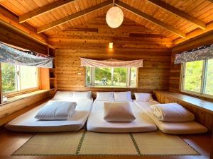 Ліжко або ліжка в номері Wen Qiao Villa