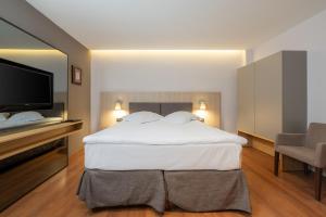 Postel nebo postele na pokoji v ubytování Hotel Nostromo