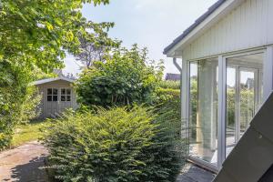 a garden view of a house with a window at 50171 Haus Antje I in Harlesiel
