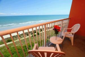 a balcony overlooking a beach with a view of the ocean at Bar Harbor in Myrtle Beach