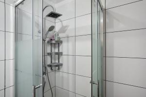 a shower with a glass door in a bathroom at Medano Beach Home Ocean View in El Médano +20 photos