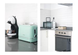 a kitchen with a refrigerator and a microwave and a stove at Karma Famara 2 25m del mar in Famara