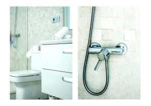a bathroom with a shower and a toilet at Karma Famara 2 25m del mar in Famara