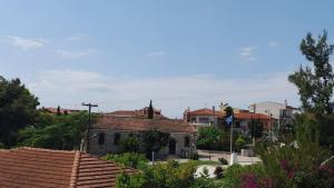 a group of houses in a town with roofs at Silot apartment 1 in Nea Fokea
