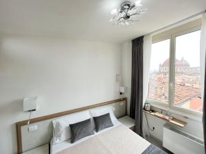 Postel nebo postele na pokoji v ubytování Hotel Ester