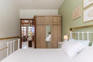 a bedroom with a bed and a sliding door at Sevi's Holiday Home, Panel Hospitality Homes & Villas in Platamonas