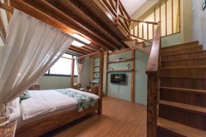 Postel nebo postele na pokoji v ubytování 心享庭園民宿 Wishes B&B