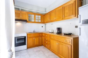 Kuchyň nebo kuchyňský kout v ubytování Cozy Apartment 2