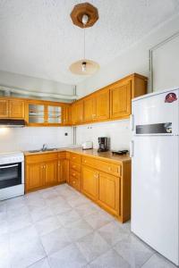 Kuchyň nebo kuchyňský kout v ubytování Cozy Apartment 2