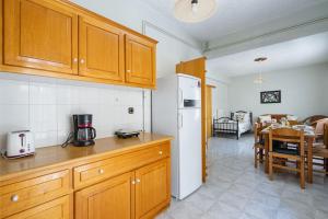 Kuchyň nebo kuchyňský kout v ubytování Cozy Apartment 2