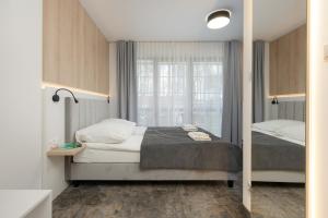 Ένα ή περισσότερα κρεβάτια σε δωμάτιο στο Willa Florek
