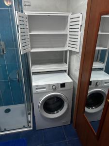 a laundry room with a washer and a washing machine at Poseidone in Lipari