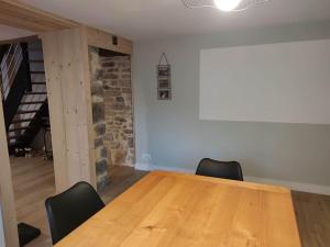 a conference room with a wooden table and chairs at La maison de Morgane in Tourmont