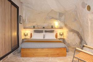 Ένα ή περισσότερα κρεβάτια σε δωμάτιο στο La réserve Stanislas & SPA