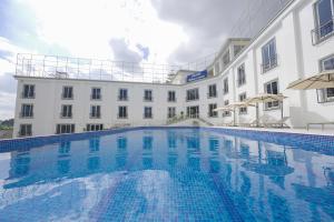 a large swimming pool in front of a building at Haile Grand Addis Ababa in Addis Ababa