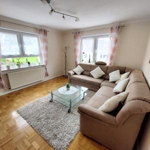a living room with a couch and a table at Ferienwohnung Hanna in Hausen