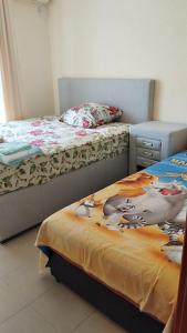 two beds sitting next to each other in a room at Dobra Voda YSV in Dobra Voda
