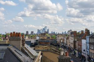 a view of a city with tall buildings in the background at Unique 2 Bedroom Flat on Stoke Newington High Street in London