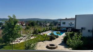 a view of a swimming pool and a building at Ancient well in Sozopol