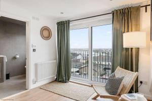 a living room with a large window with a view at Stylish & Modern Home, Central Newquay w/parking in Newquay