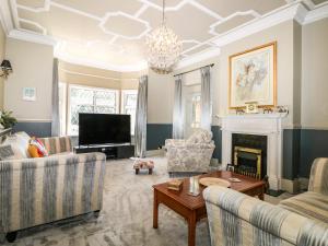 a living room with two couches and a fireplace at The Hideaway in Brighton & Hove