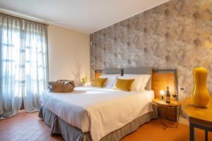 Postel nebo postele na pokoji v ubytování Braida Wine Resort