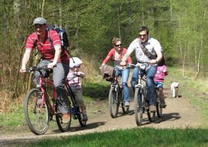 a group of people riding bikes on a trail at Meadow Byre in Little Dean
