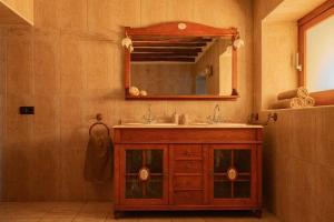 a bathroom with a sink and a mirror at Finca Norte, Amazing villa close to the best Beaches in Portinatx