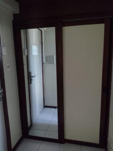 a bathroom with two sliding doors in a room at Royal Service Hotel - Tambaú - ap 111 in João Pessoa +22 photos