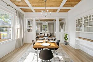 a dining room with a table and chairs at Urban Elegance Retreat in San Antonio