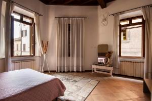 A bed or beds in a room at CasaLonghi