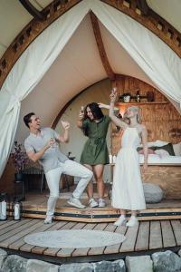 a group of people dancing in a tent at WOW magisches Luxus Glamping mit Pool im Paradies in Bad Salzdetfurth