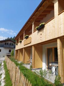 a building with a fence in front of it at Hotel Gasthof Klause Dependance 2 in Reutte