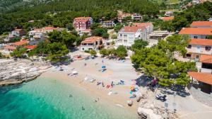 an aerial view of a beach with people in the water at Beach Dream Apartments in Ivan Dolac