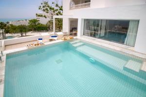 a large swimming pool in a building at Royal Azur Thalassa in Hammamet
