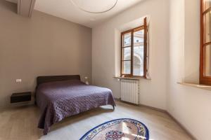 A bed or beds in a room at CasaLonghi