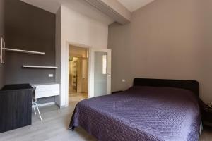 A bed or beds in a room at CasaLonghi