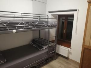 Palanda nebo palandy na pokoji v ubytování Au Vieux Gouvy