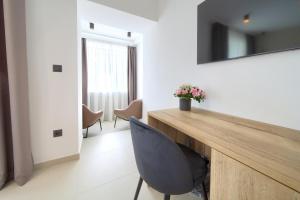 TV a/nebo společenská místnost v ubytování Portella Rooms