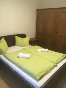 a large bed with two towels on top of it at Aineterhof in Ainet