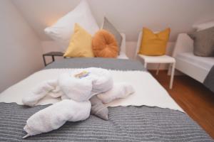 a room with a bed with towels on it at NUE12-RI Apartment in Zirndorf in Zirndorf