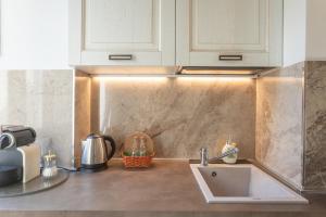 a kitchen with a sink and a counter top at Boutique Ponte Vecchio in Florence